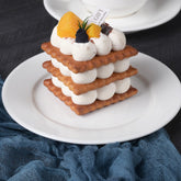 7-inch round white porcelain dessert plate perfect for cakes, pastries, and snacks